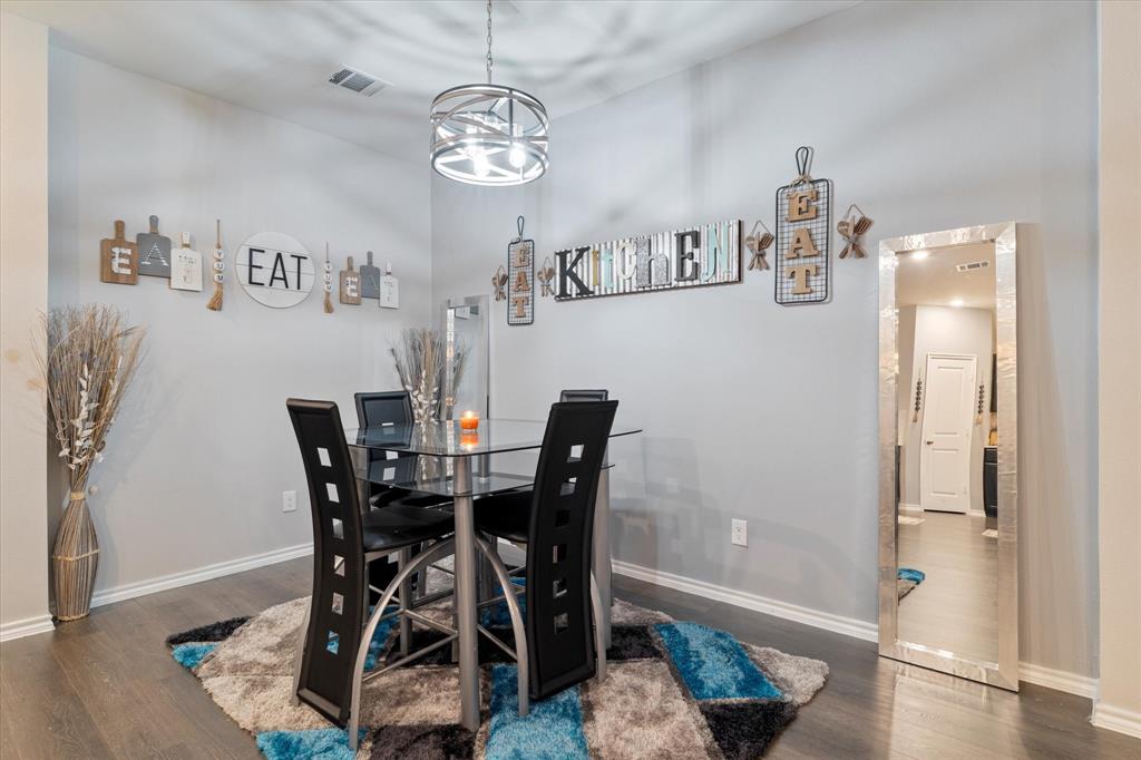 113 Clason Road Royse City, TX 75189 - Photo 11 of 25 a view of a dining room with furniture and wooden floor