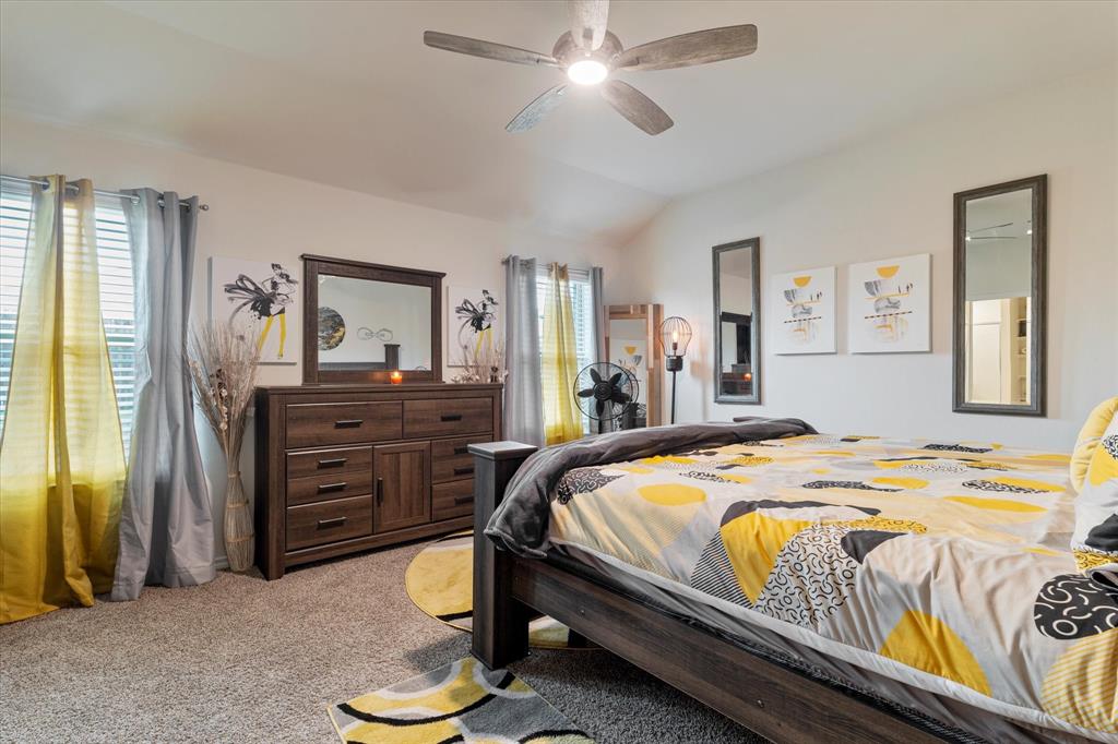 113 Clason Road Royse City, TX 75189 - Photo 12 of 25 a bedroom with a bed and a dresser