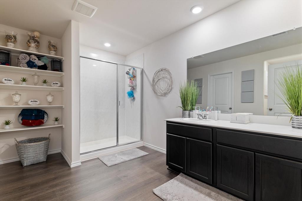 113 Clason Road Royse City, TX 75189 - Photo 14 of 25 a bathroom with a sink and a mirror