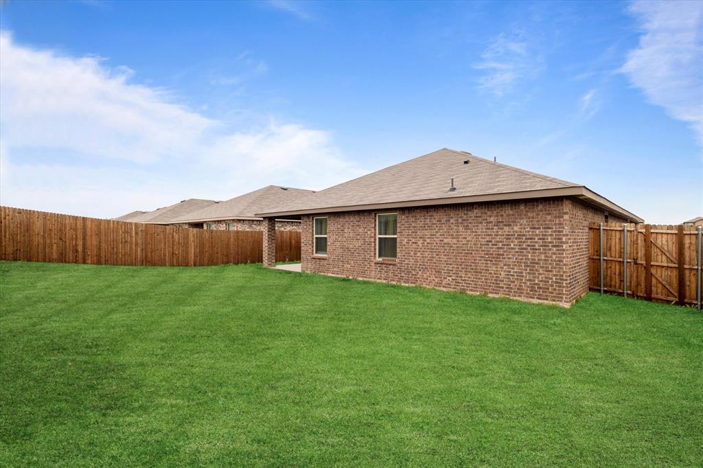 113 Clason Road Royse City, TX 75189 - Photo 24 of 25 a view of a backyard with wooden fence