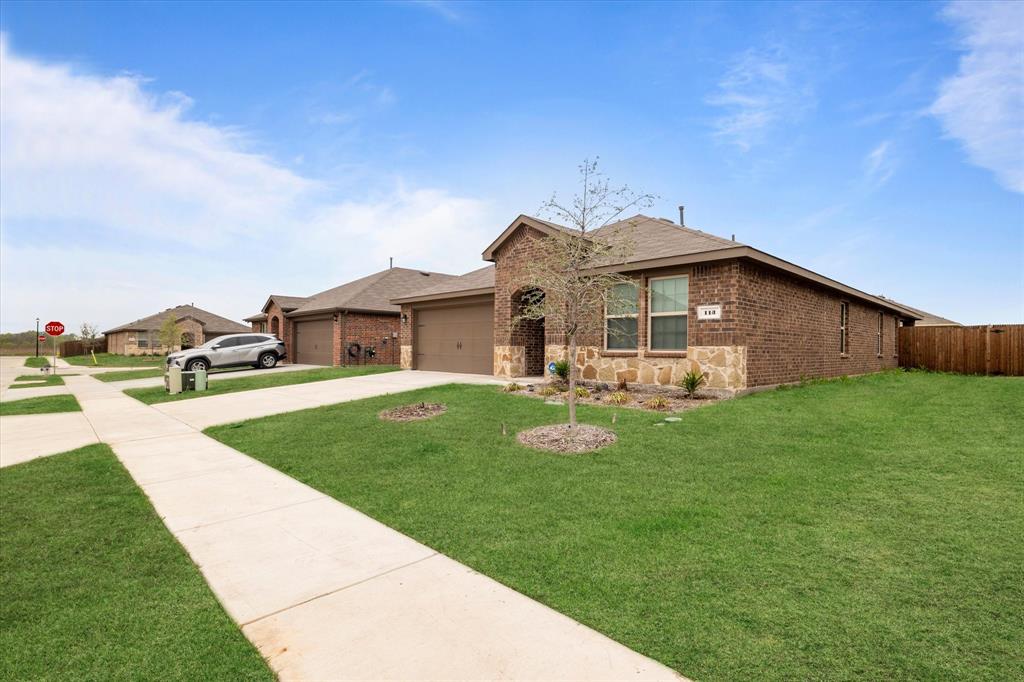 113 Clason Road Royse City, TX 75189 - Photo 3 of 25 a front view of a house with garden