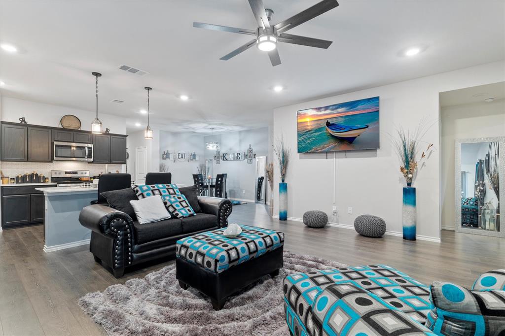 113 Clason Road Royse City, TX 75189 - Photo 6 of 25 a living room with furniture and kitchen view