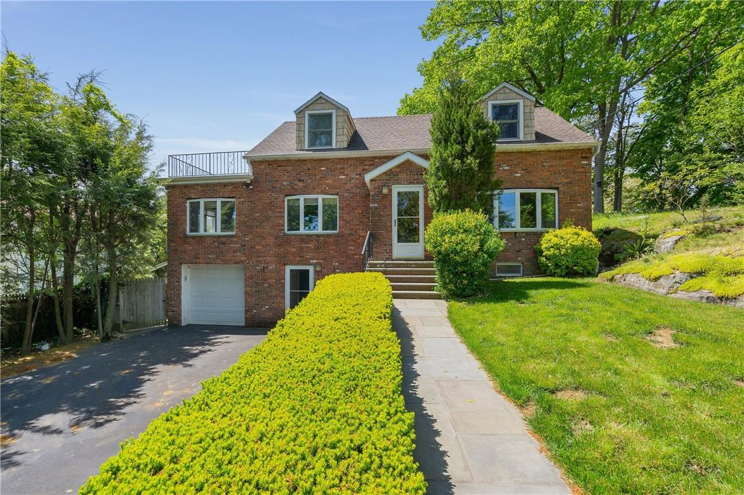 49 Avondale Road Harrison, NY 10528 - Photo 1 of 1 a front view of a house with garden