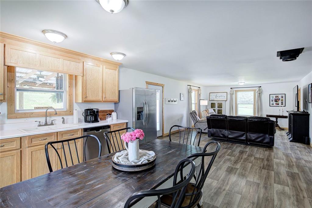 765 Addison Road Buchanan, GA 30113 - Photo 13 of 50 a kitchen with a table and chairs in it