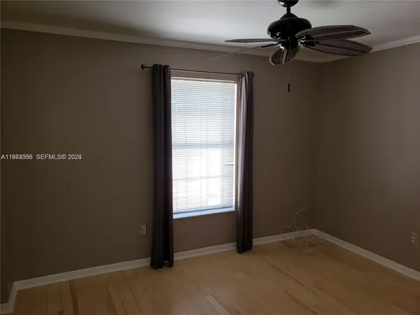 a white toilet sitting next to a bath tub