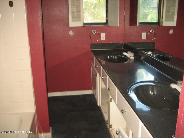 1834 Ector Road Jacksonville, FL 32211 - Photo 9 of 10 a bathroom with a sink and a mirror