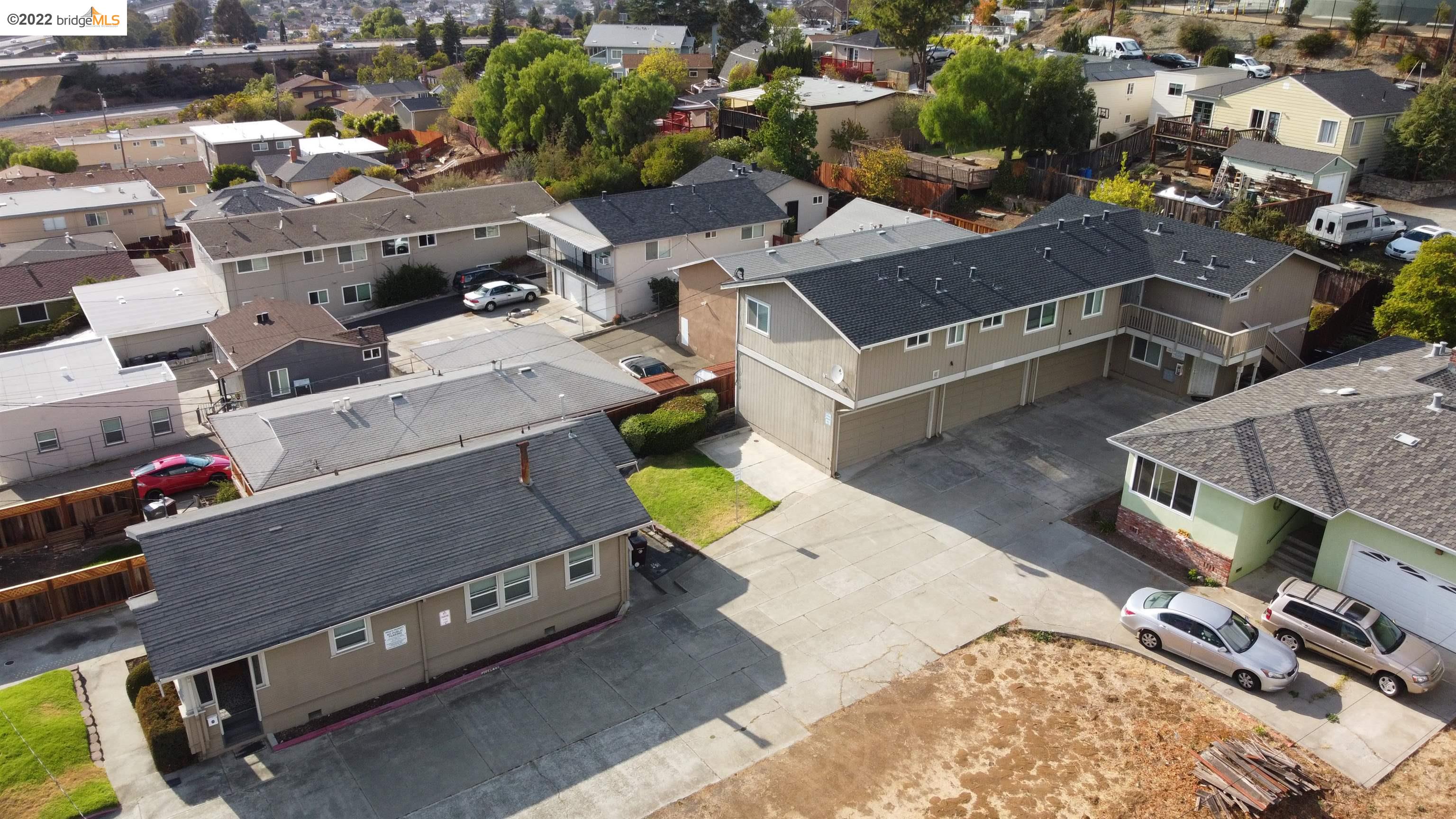an aerial view of a house with a parking space