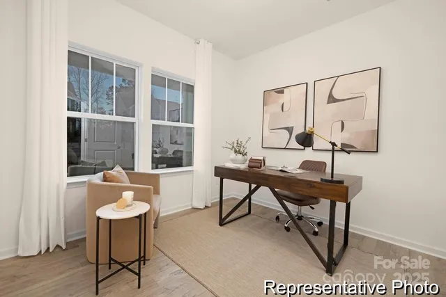 a view of a room with a table and chairs