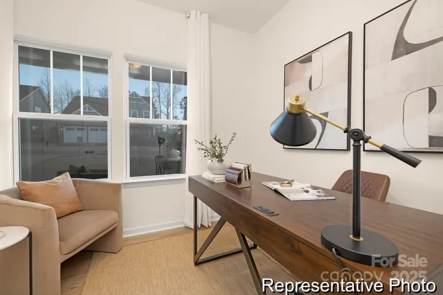 a work room with furniture and view of a bathroom