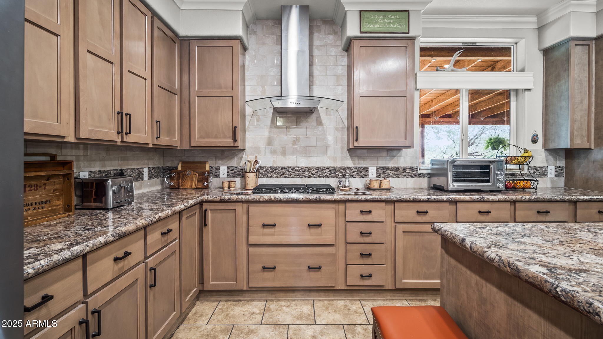 3155 West Elephant Head Road Amado, AZ 85645 - Photo 17 of 79 a kitchen with granite countertop a sink stainless steel appliances and cabinets