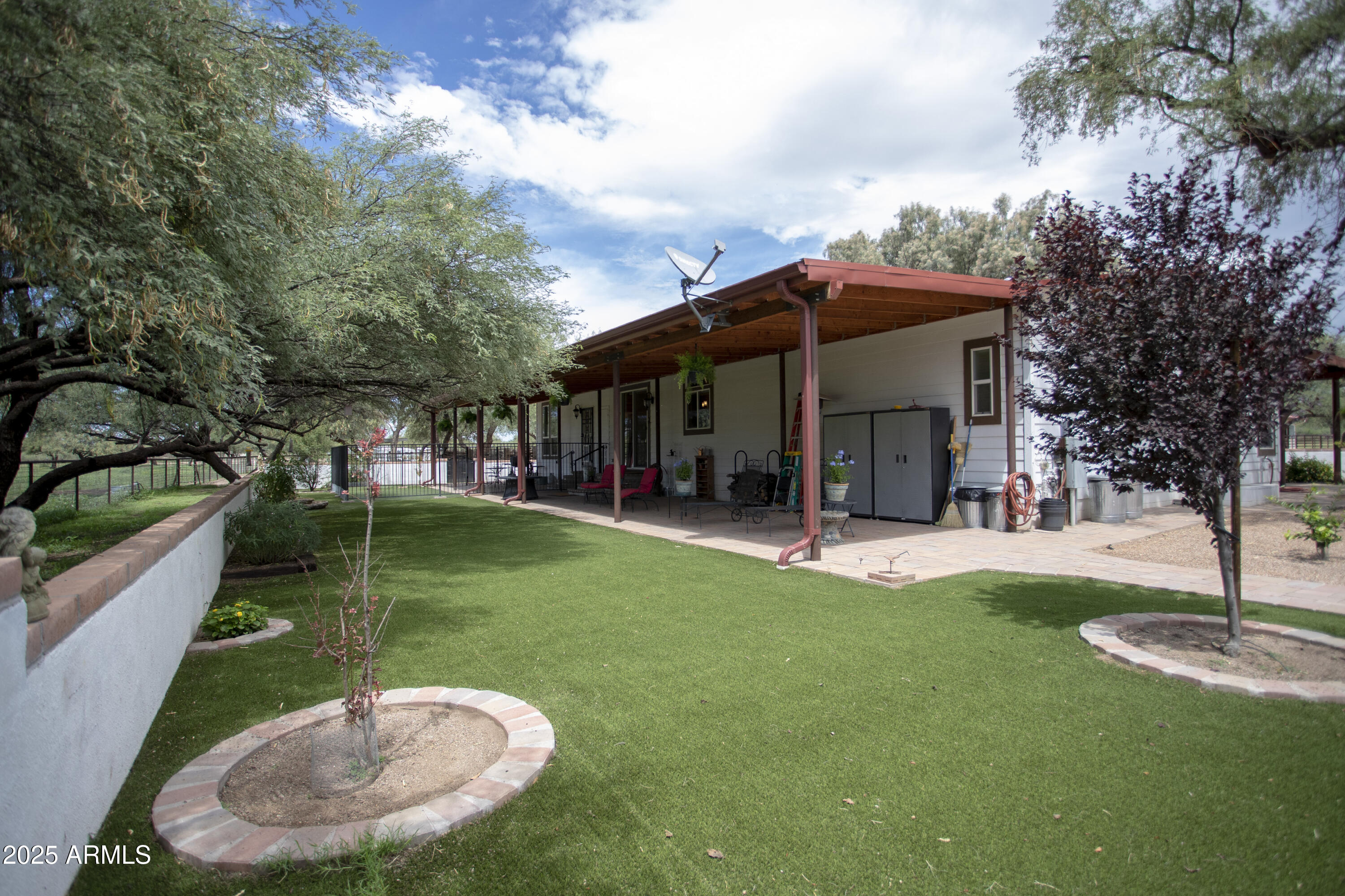 3155 West Elephant Head Road Amado, AZ 85645 - Photo 27 of 79 a view of a house with a backyard porch and sitting area