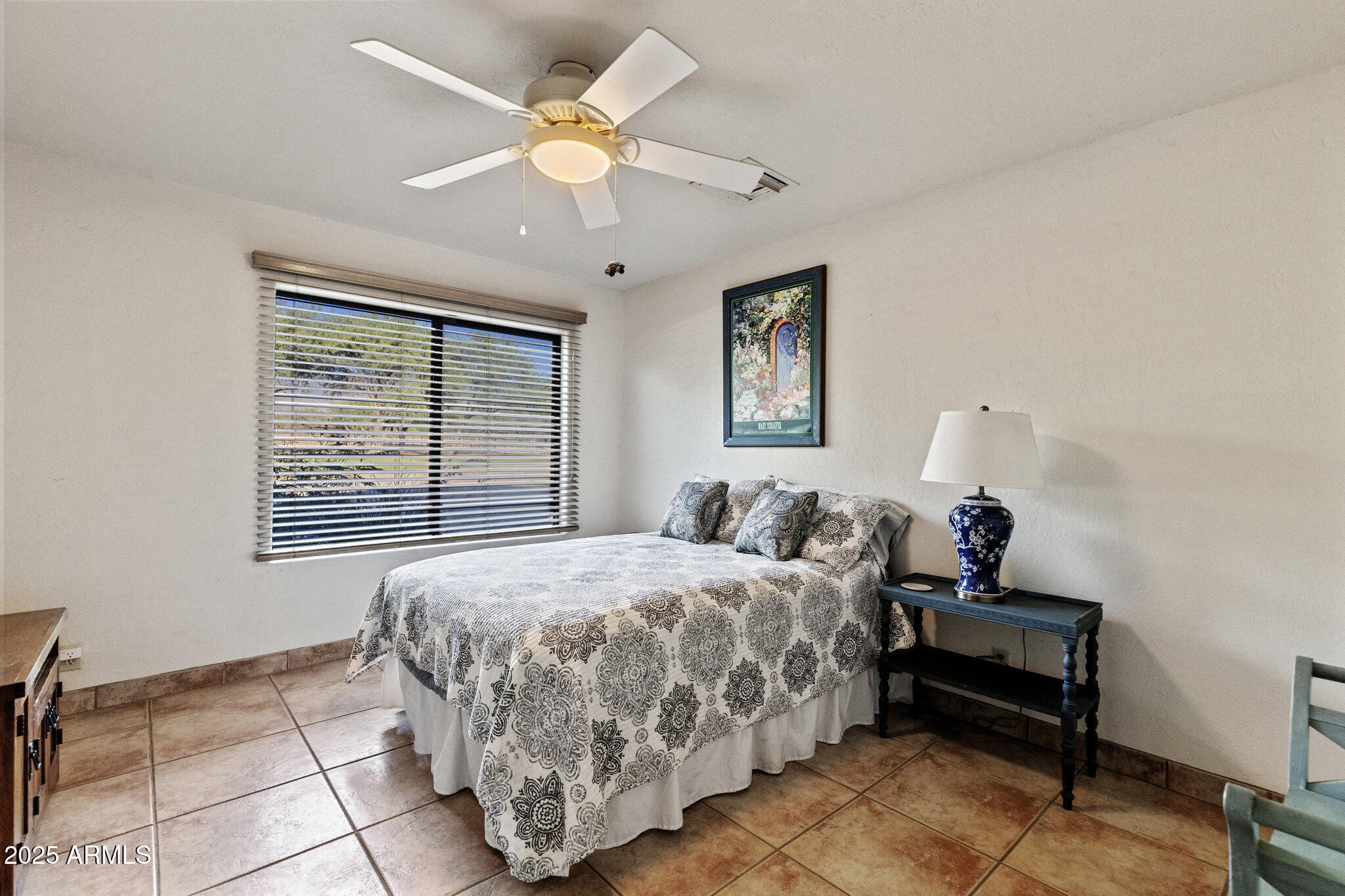 3155 West Elephant Head Road Amado, AZ 85645 - Photo 35 of 79 a bedroom with a bed and a window