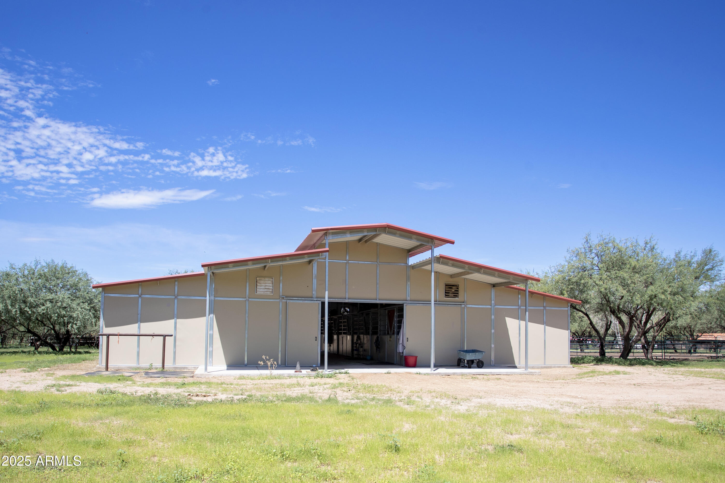 3155 West Elephant Head Road Amado, AZ 85645 - Photo 56 of 79 a large house with a big yard and large trees