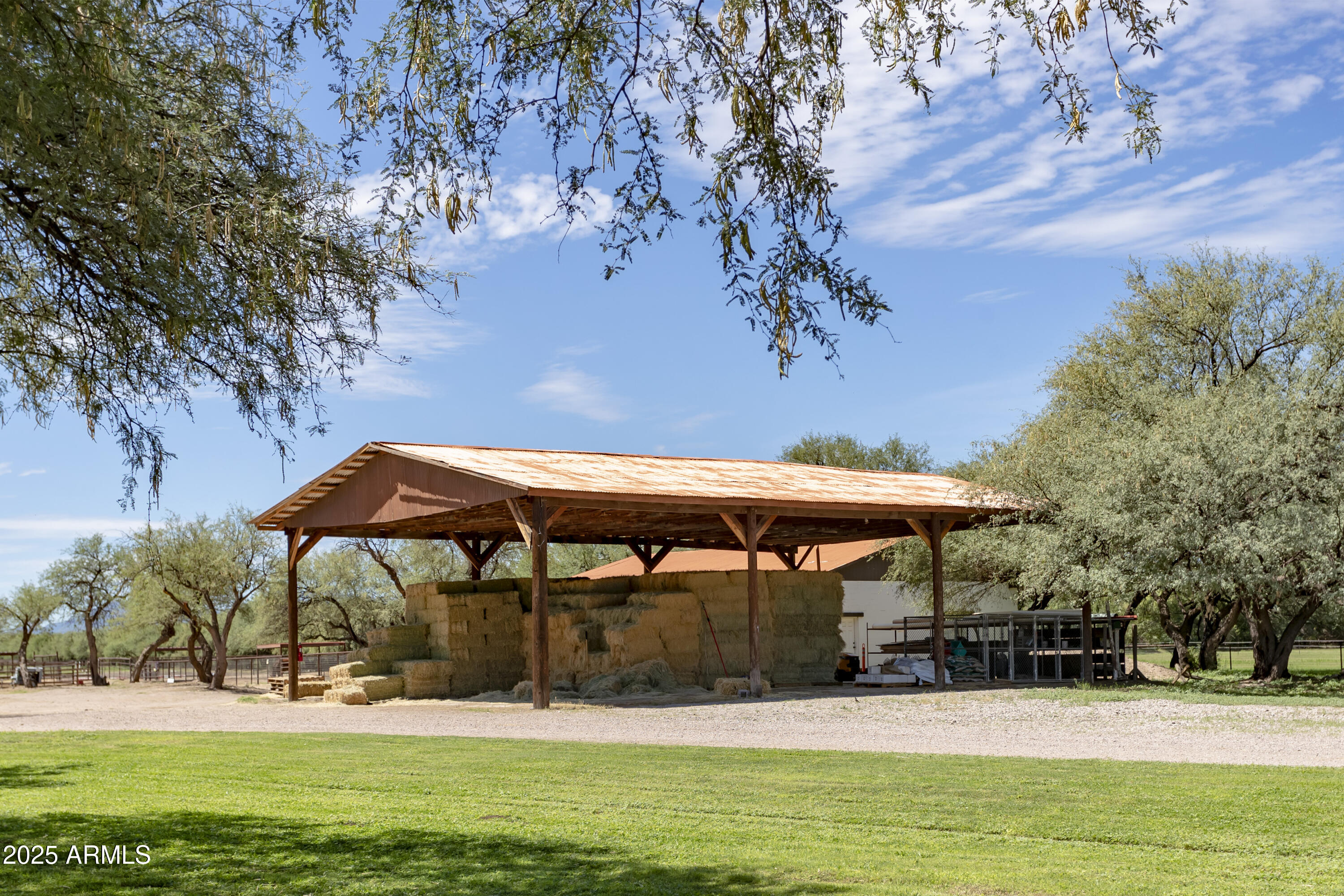 3155 West Elephant Head Road Amado, AZ 85645 - Photo 67 of 79 a view of patio with a table and chairs under an umbrella