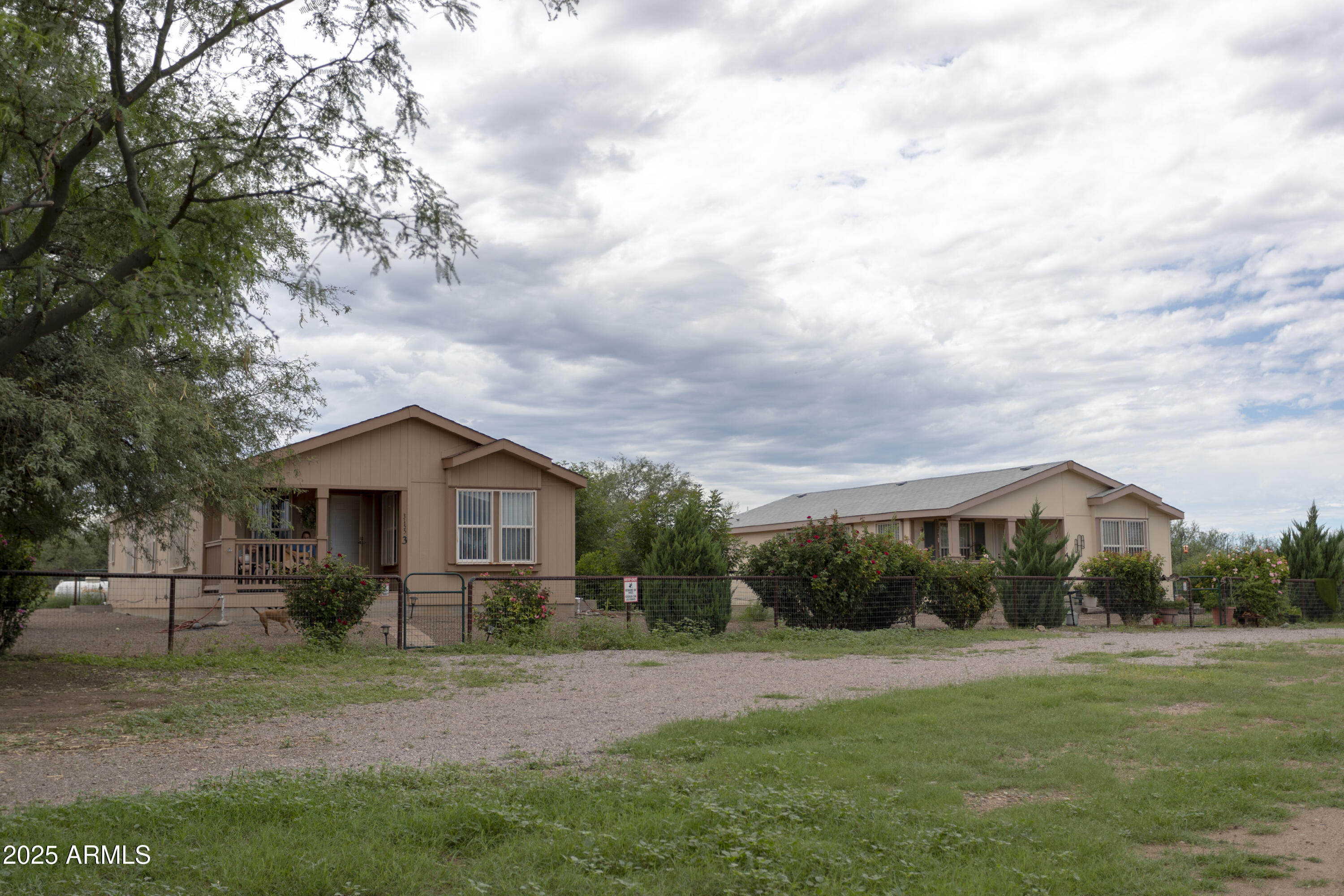 3155 West Elephant Head Road Amado, AZ 85645 - Photo 71 of 79 a front view of a house with a yard