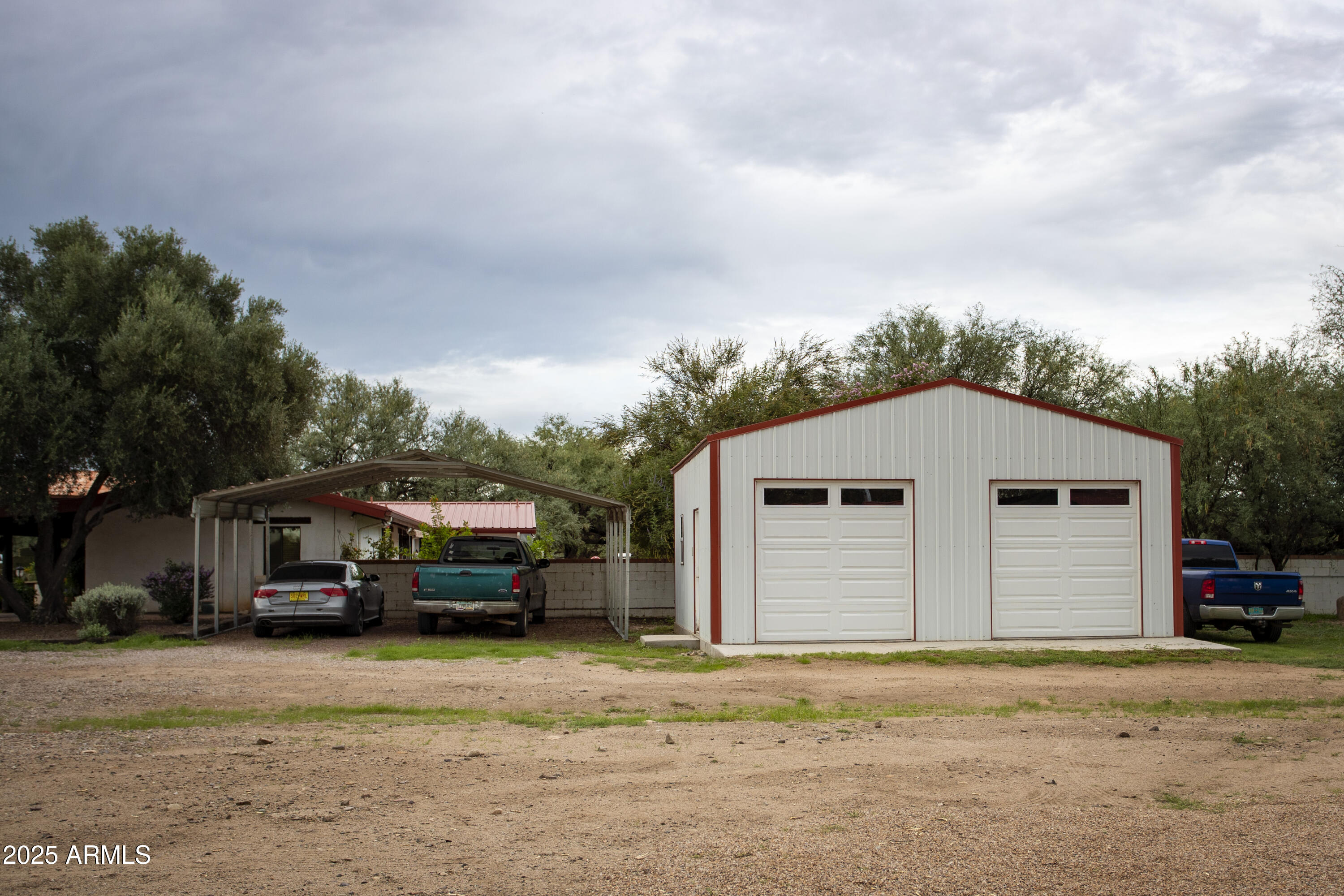 3155 West Elephant Head Road Amado, AZ 85645 - Photo 76 of 79 a car parked in front of a house