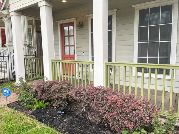 a view of a house with a flower garden