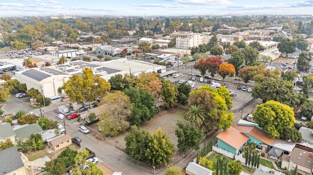 an aerial view of residential house with parking
