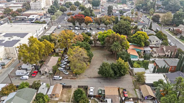 an aerial view of houses with outdoor space