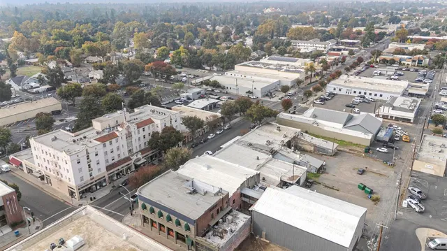 an aerial view of a balcony with chairs