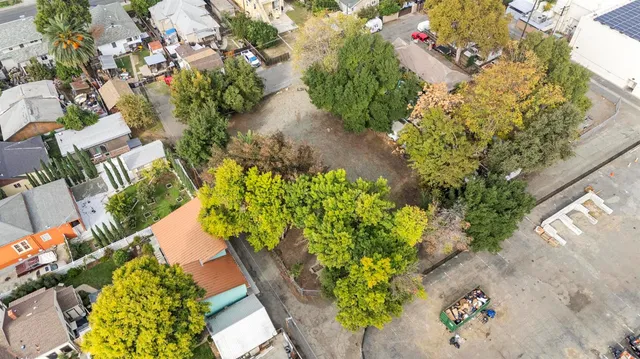 an aerial view of residential houses with outdoor space