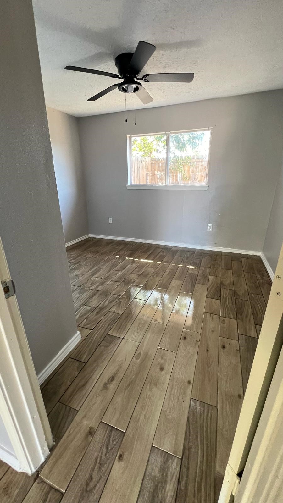 5022 Mallow Street, Unit 7 Houston, TX 77033 - Photo 11 of 20 a view of an empty room and window