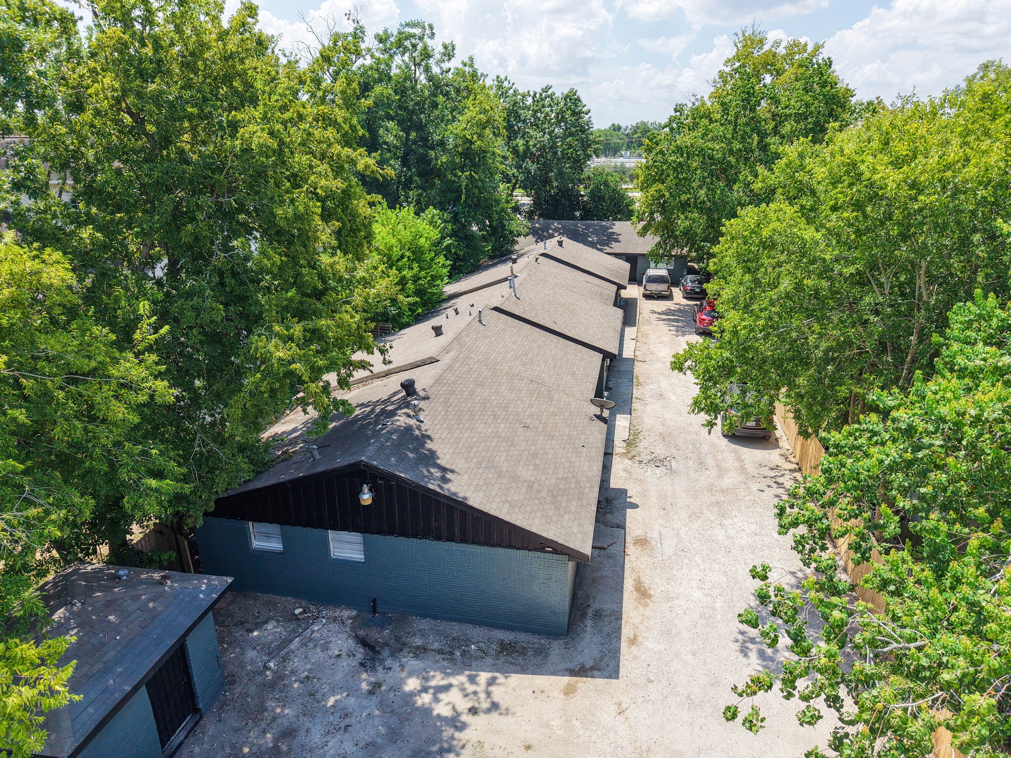 5022 Mallow Street, Unit 7 Houston, TX 77033 - Photo 19 of 20 an aerial view of a house with a yard