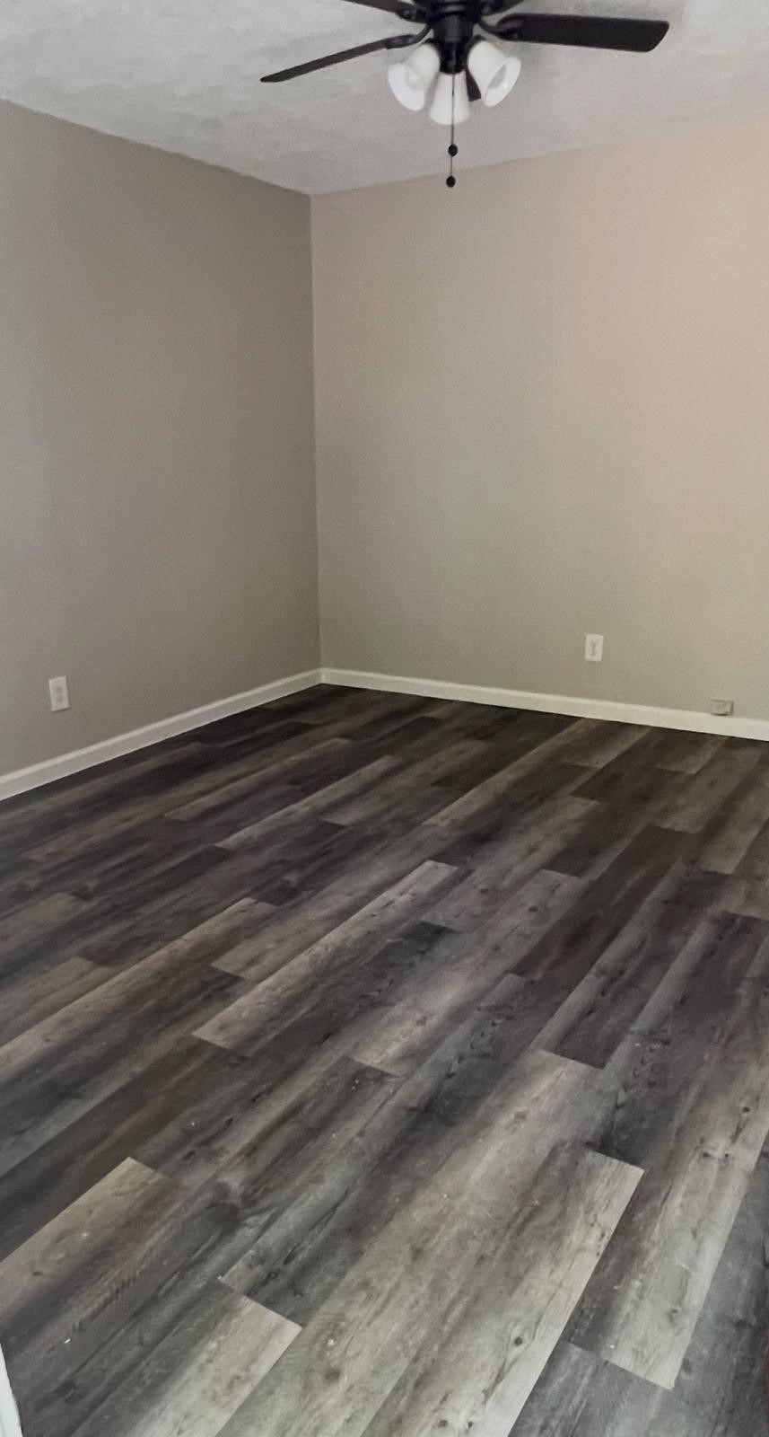 5022 Mallow Street, Unit 7 Houston, TX 77033 - Photo 9 of 20 a view of a room with a sink and wooden floor