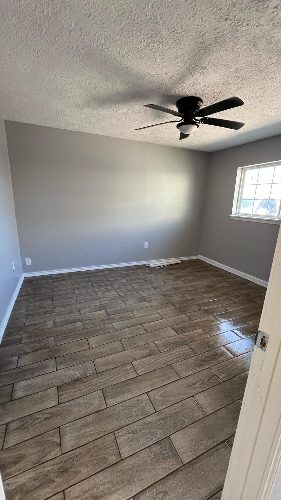 5022 Mallow Street, Unit 7 Houston, TX 77033 - Photo 10 of 20 a view of a room with wooden floor