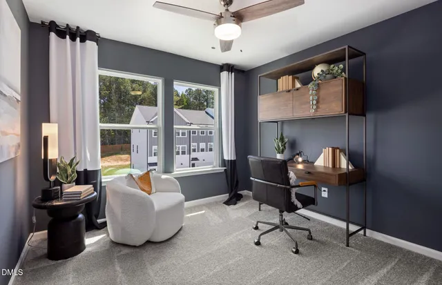 a view of a hallway with paintings on the wall