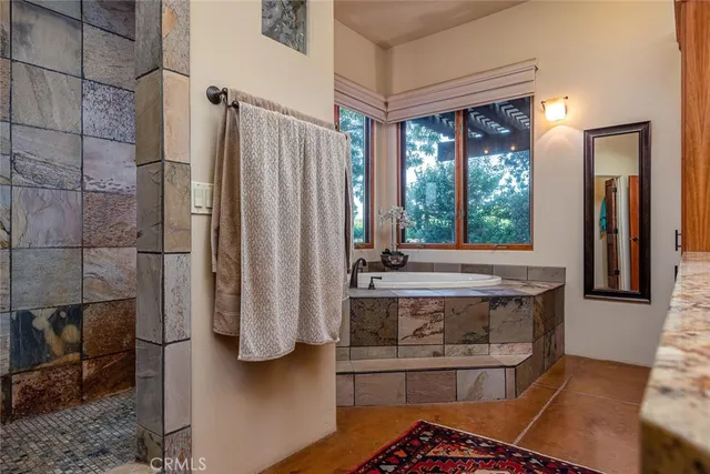 a view of a chairs and table in a patio