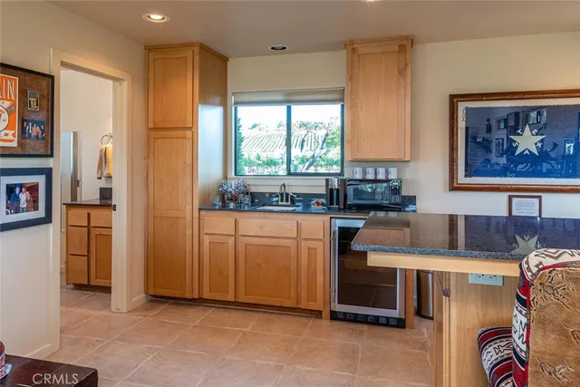 a room with lots of potted plants and a fountain