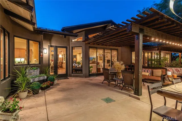 a view of a backyard with swimming pool