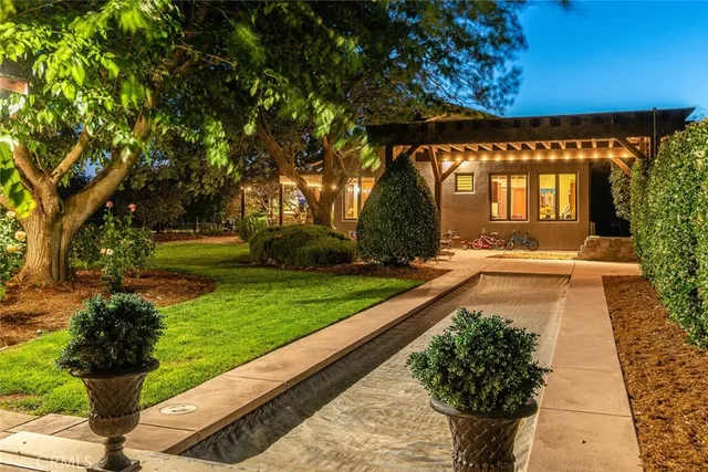 a front view of a house with garden