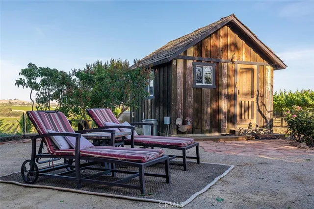 a kitchen with stainless steel appliances kitchen island granite countertop a refrigerator and a sink