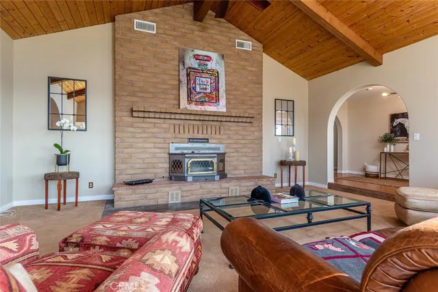 a front view of a house with a yard covered in snow
