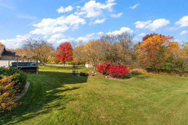 a view of a house with backyard