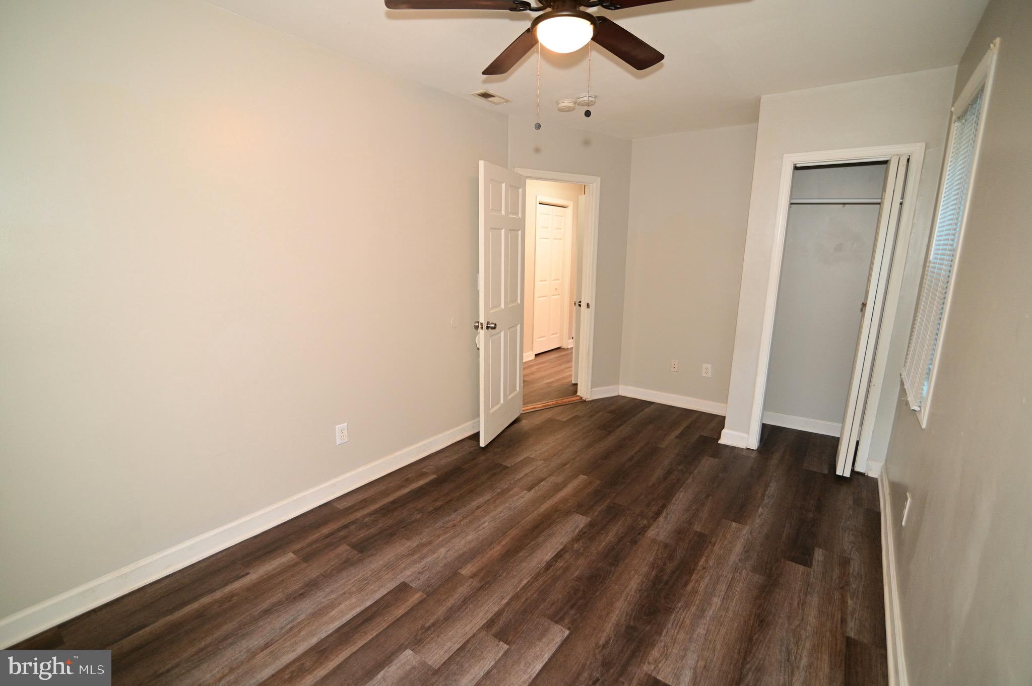 431 Mellon Street Southeast, Unit 2 Washington, DC 20032 - Photo 18 of 24 wooden floor in an empty room