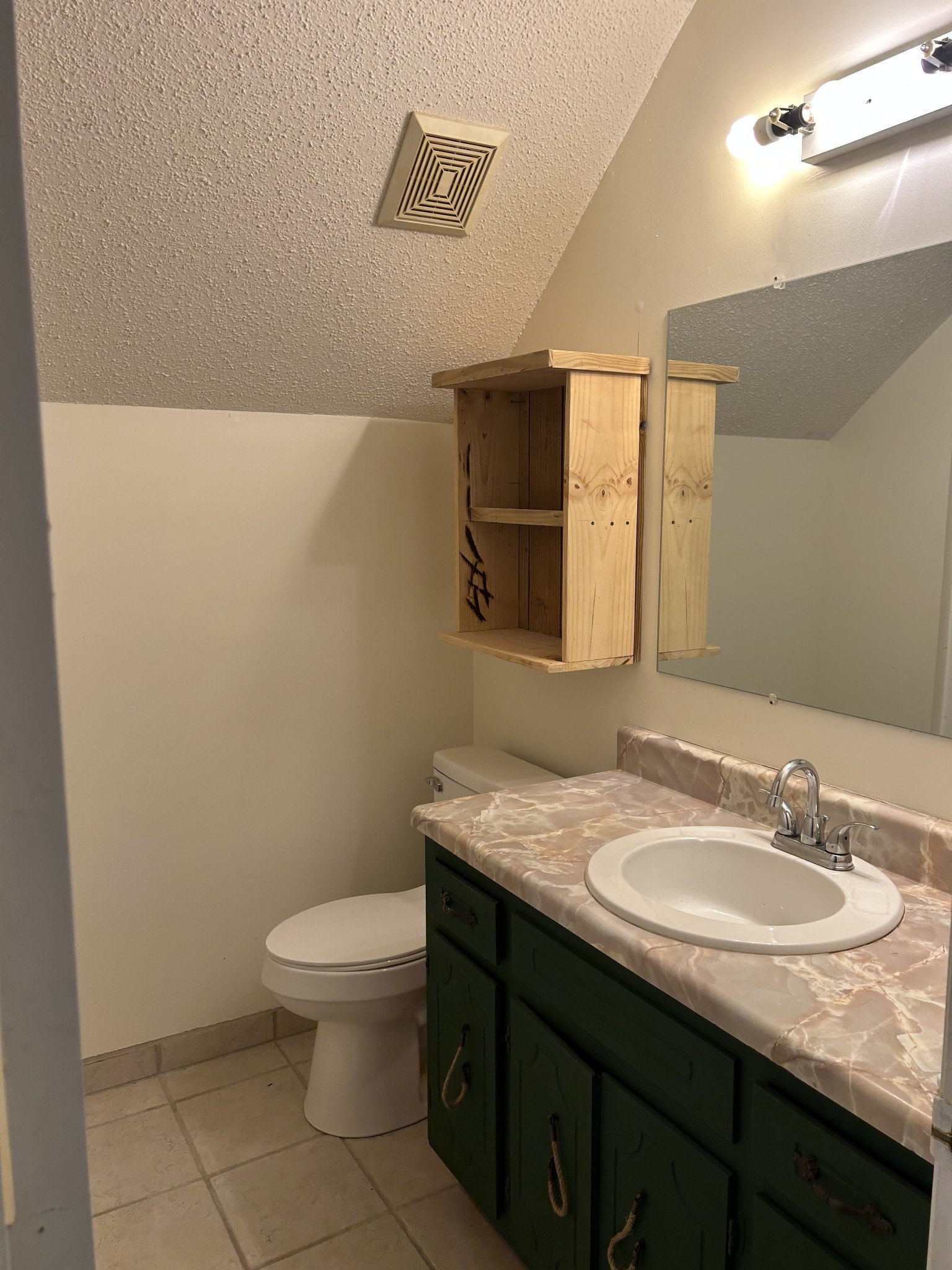 2319 7 Mile Ferry Road Clarksville, TN 37040 - Photo 11 of 15 a bathroom with a granite countertop sink a toilet and a mirror
