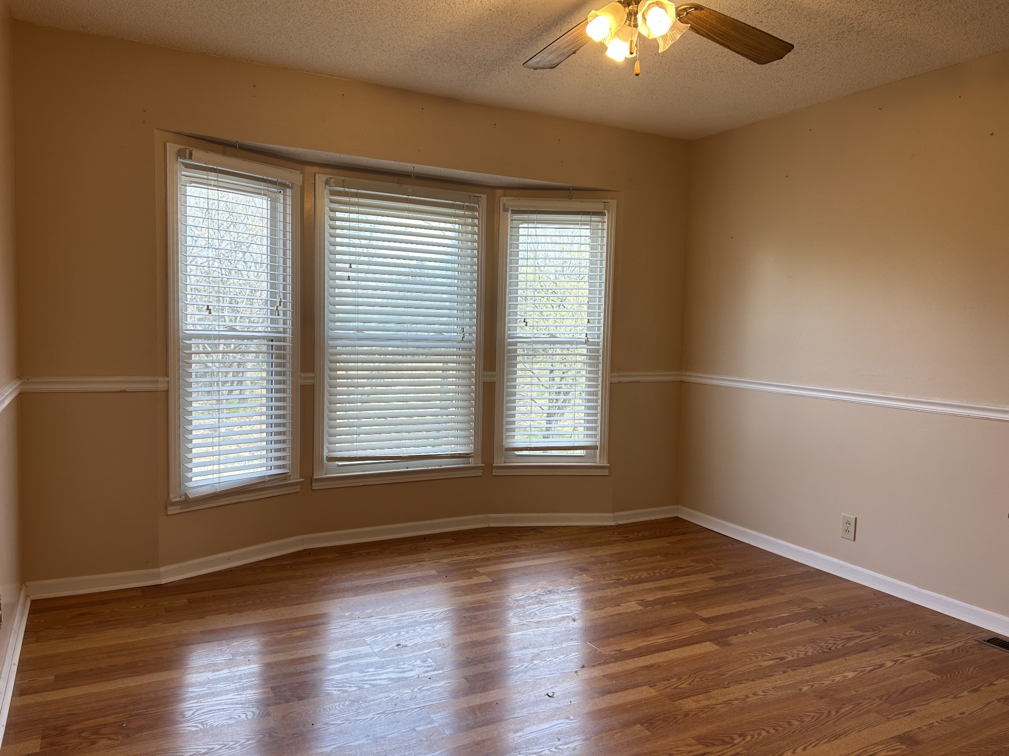 2319 7 Mile Ferry Road Clarksville, TN 37040 - Photo 4 of 15 an empty room with wooden floor and windows