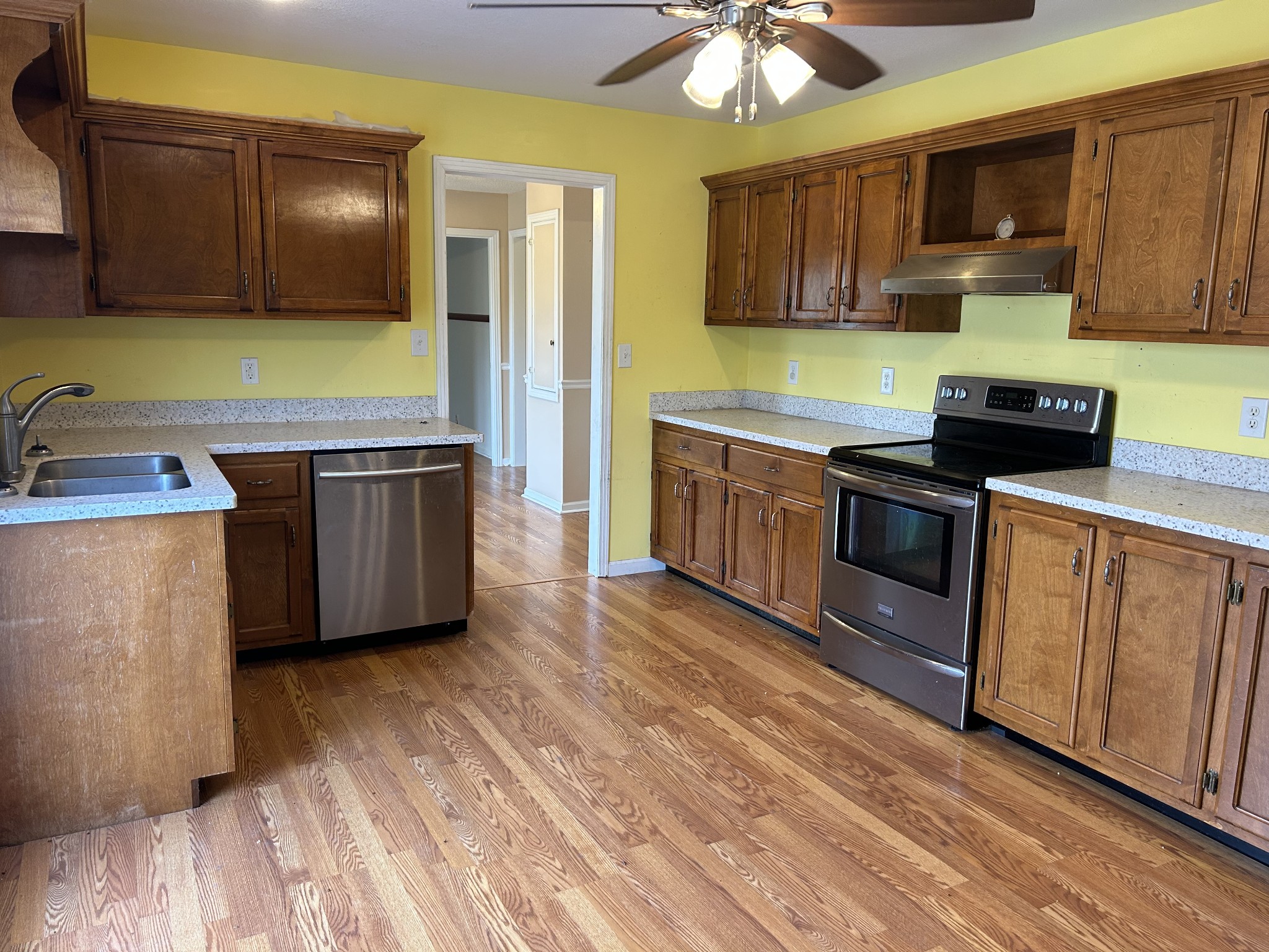 2319 7 Mile Ferry Road Clarksville, TN 37040 - Photo 6 of 15 a kitchen with stainless steel appliances granite countertop a sink and a stove top oven