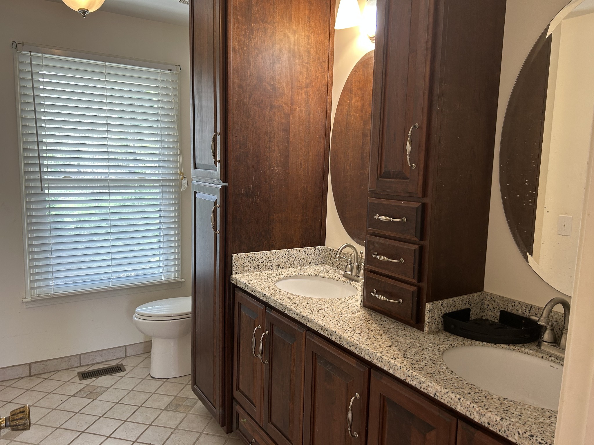 2319 7 Mile Ferry Road Clarksville, TN 37040 - Photo 8 of 15 a bathroom with a granite countertop sink toilet and mirror