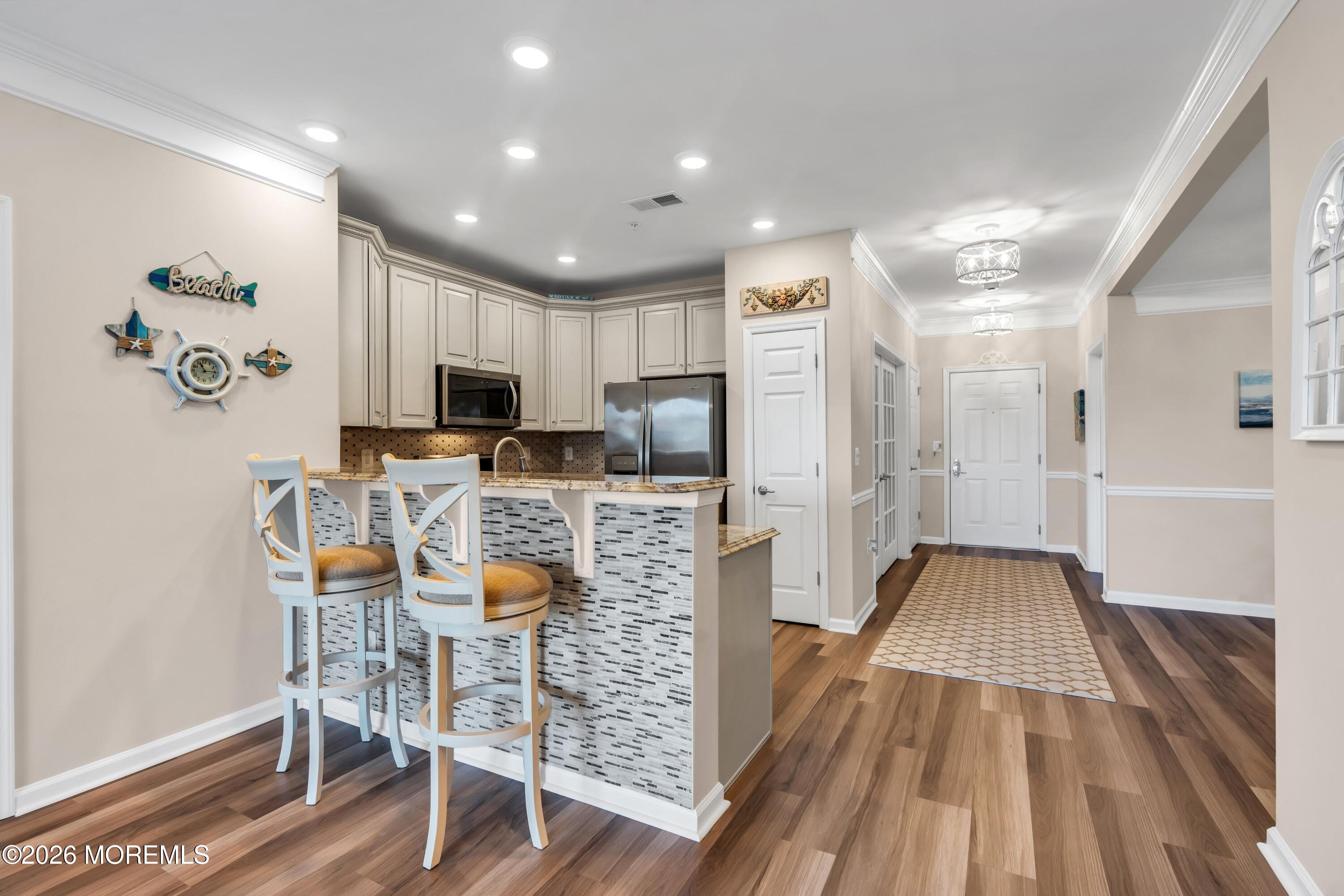 2201 River Road, Unit 4303 Point Pleasant, NJ 08742 - Photo 15 of 36 a view of kitchen with cabinets and wooden floor