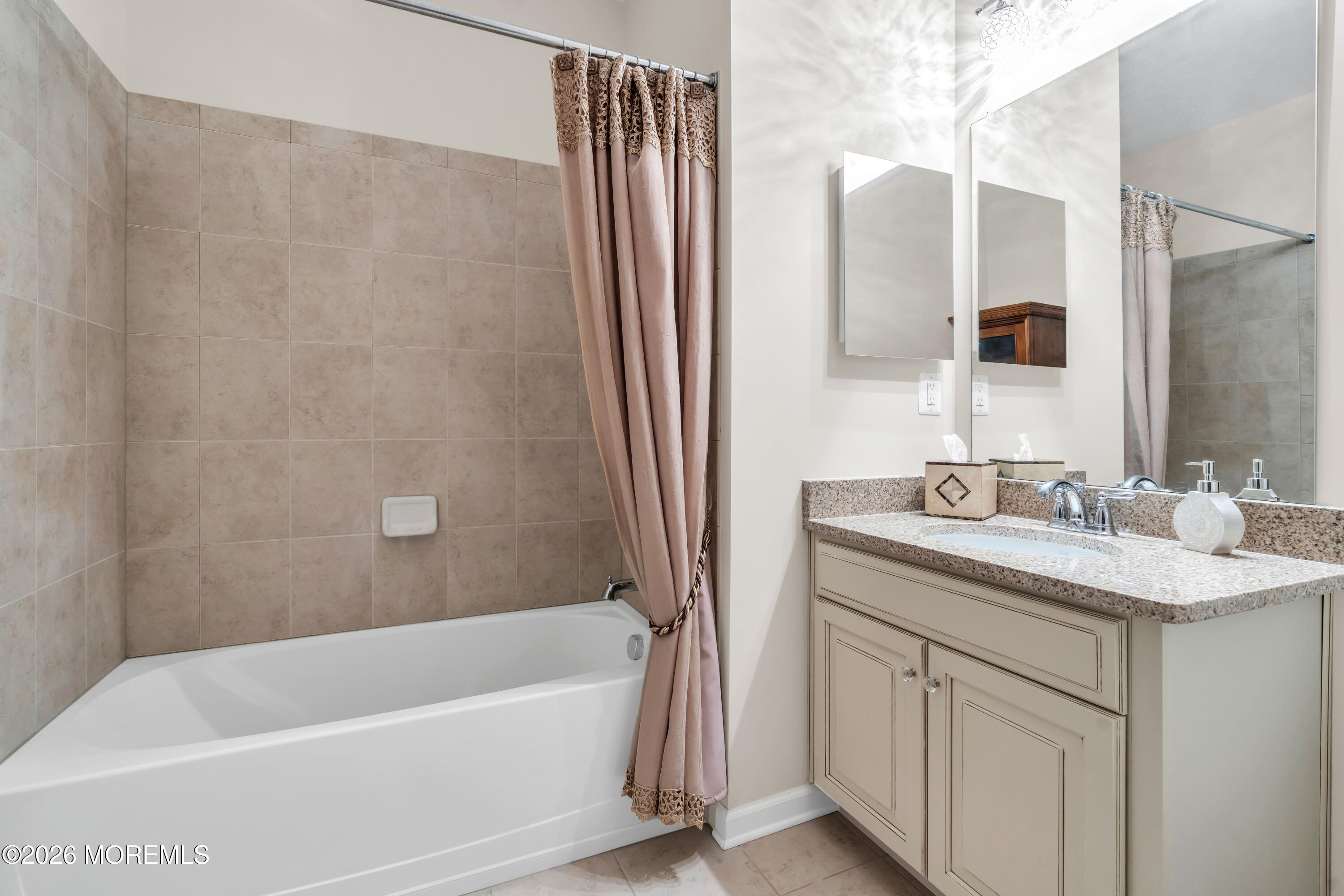 2201 River Road, Unit 4303 Point Pleasant, NJ 08742 - Photo 22 of 36 a bathroom with a granite countertop sink toilet and shower