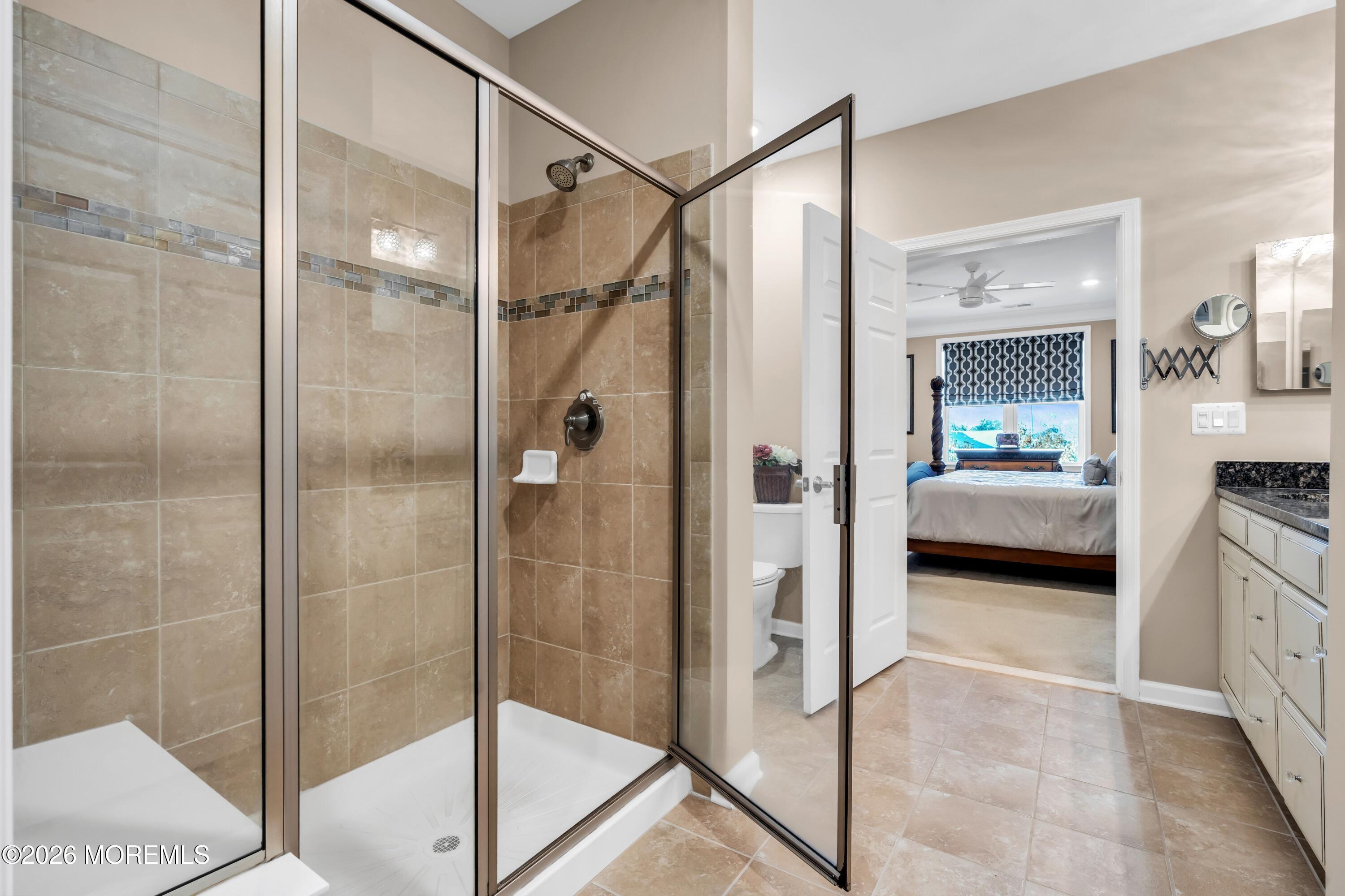 2201 River Road, Unit 4303 Point Pleasant, NJ 08742 - Photo 28 of 36 a bathroom with a shower and a sink