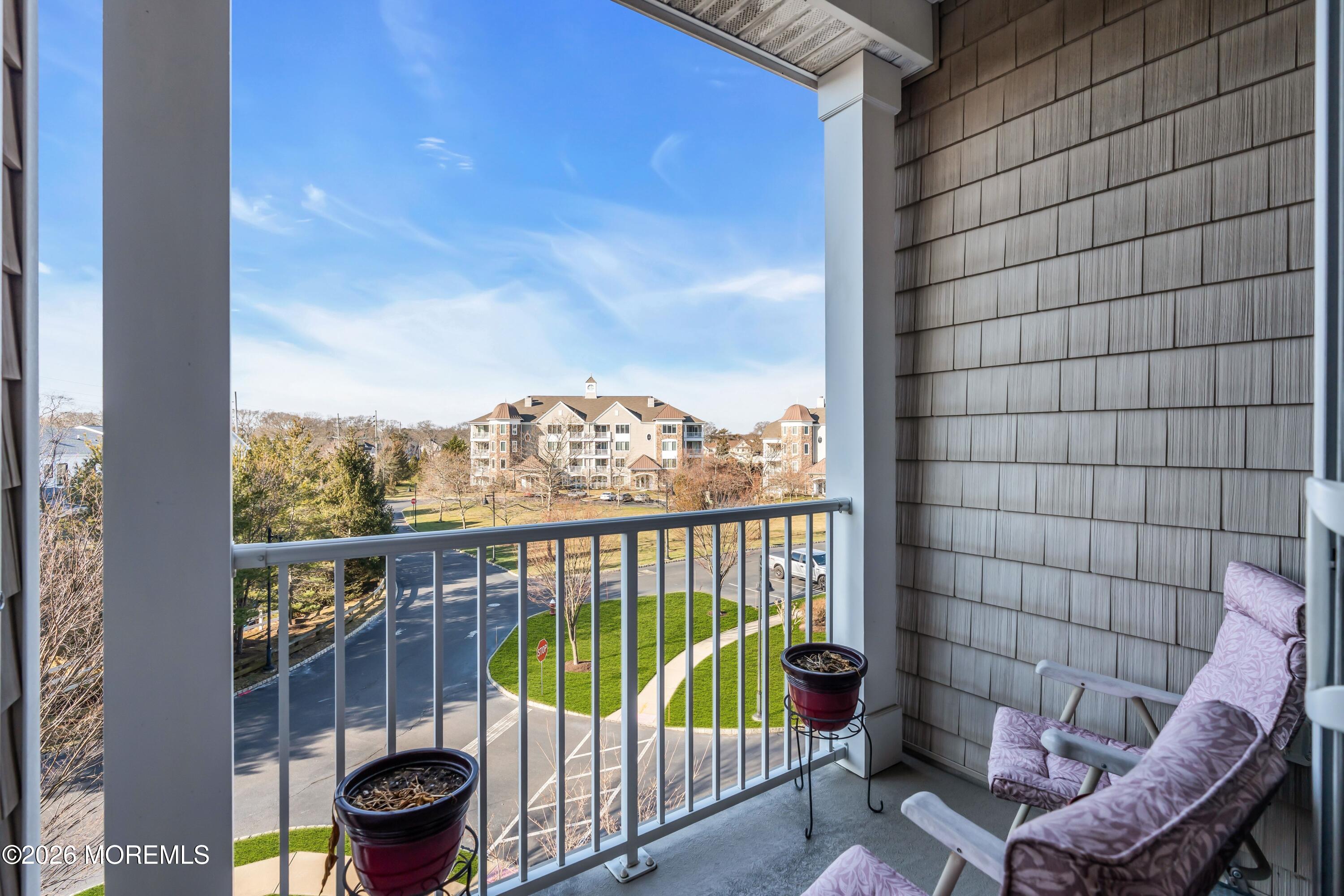 2201 River Road, Unit 4303 Point Pleasant, NJ 08742 - Photo 32 of 36 a view of a balcony with chair and city view