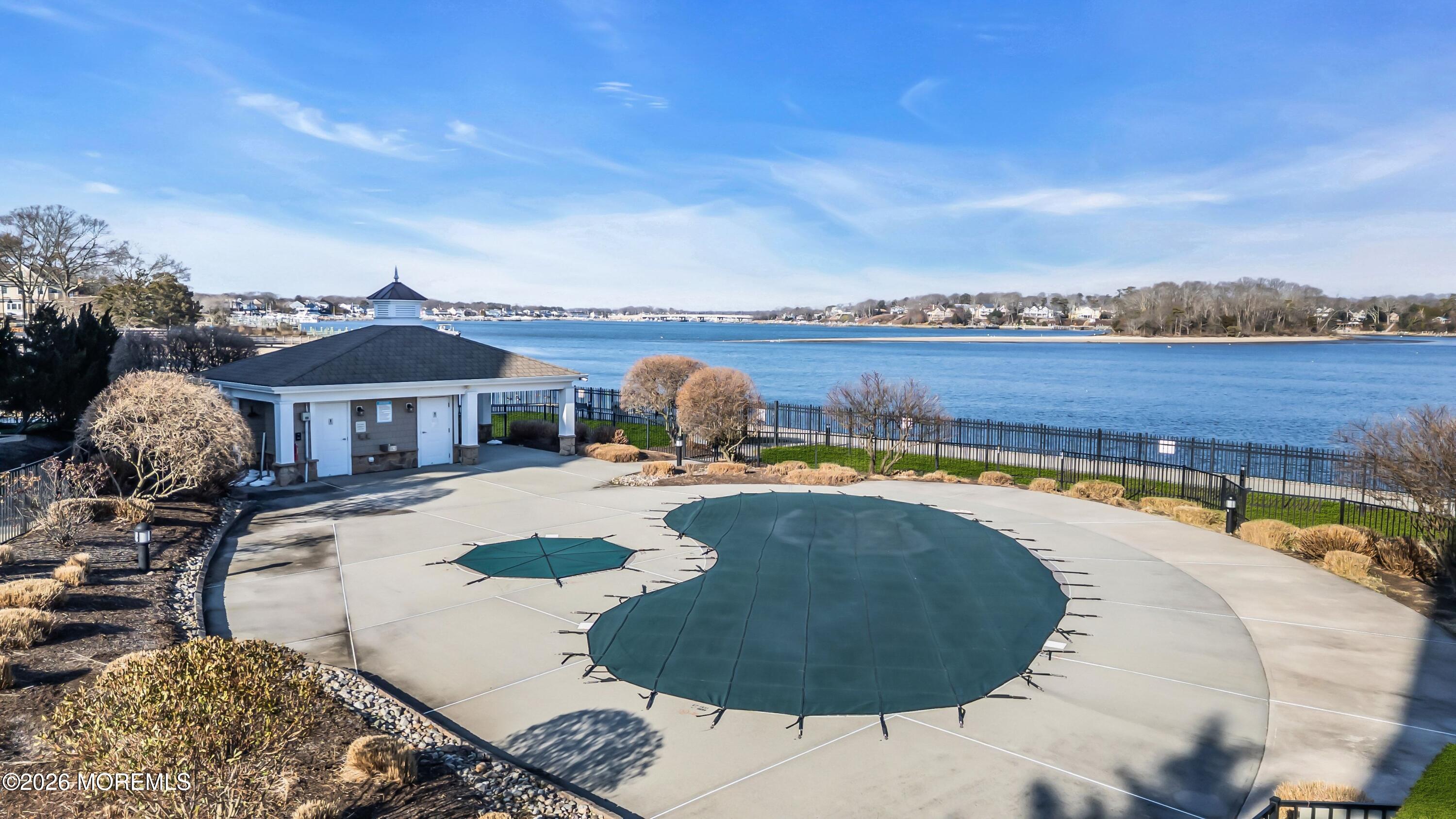 2201 River Road, Unit 4303 Point Pleasant, NJ 08742 - Photo 35 of 36 a swimming pool with outdoor seating and barbeque area