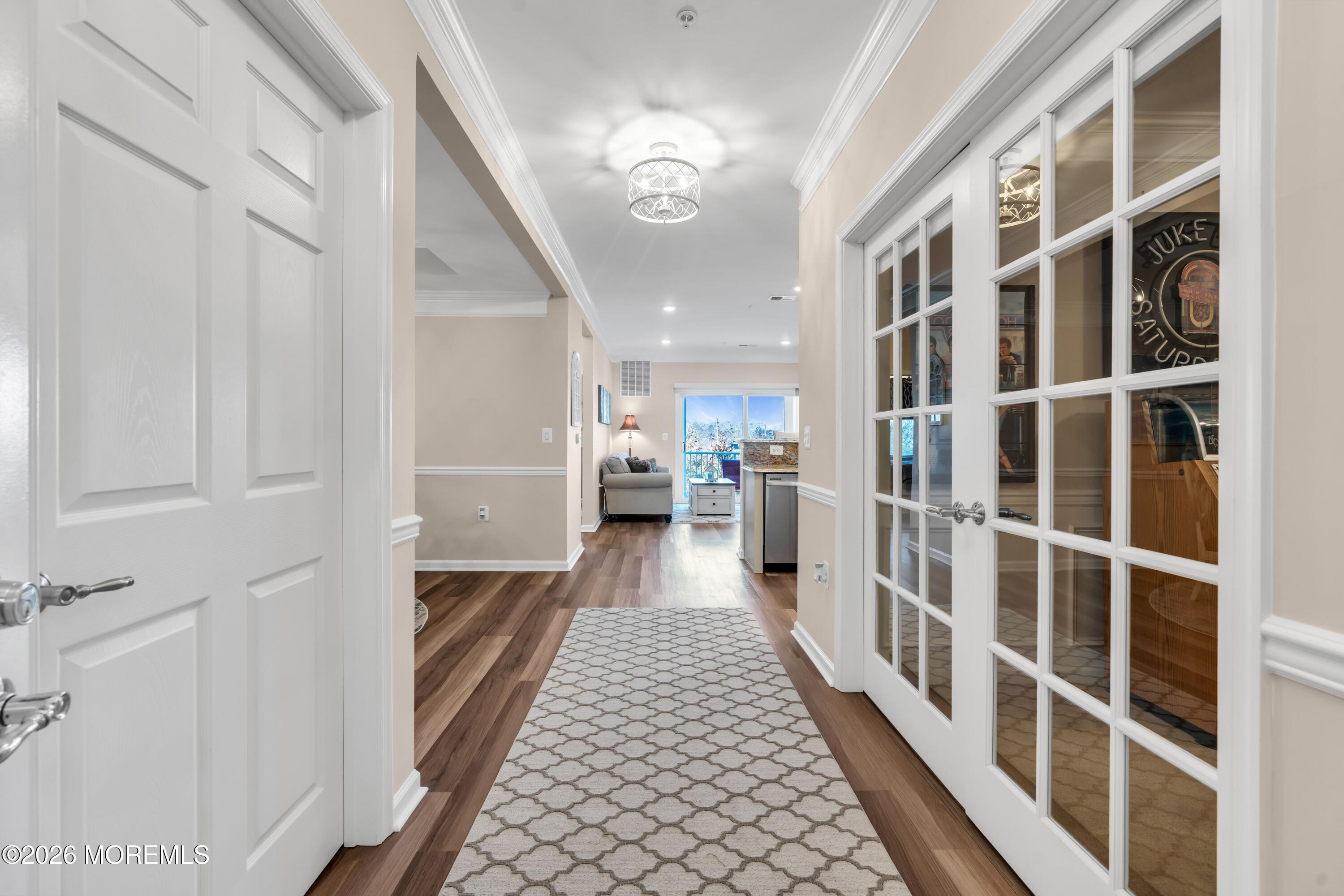 2201 River Road, Unit 4303 Point Pleasant, NJ 08742 - Photo 6 of 36 a hallway with windows