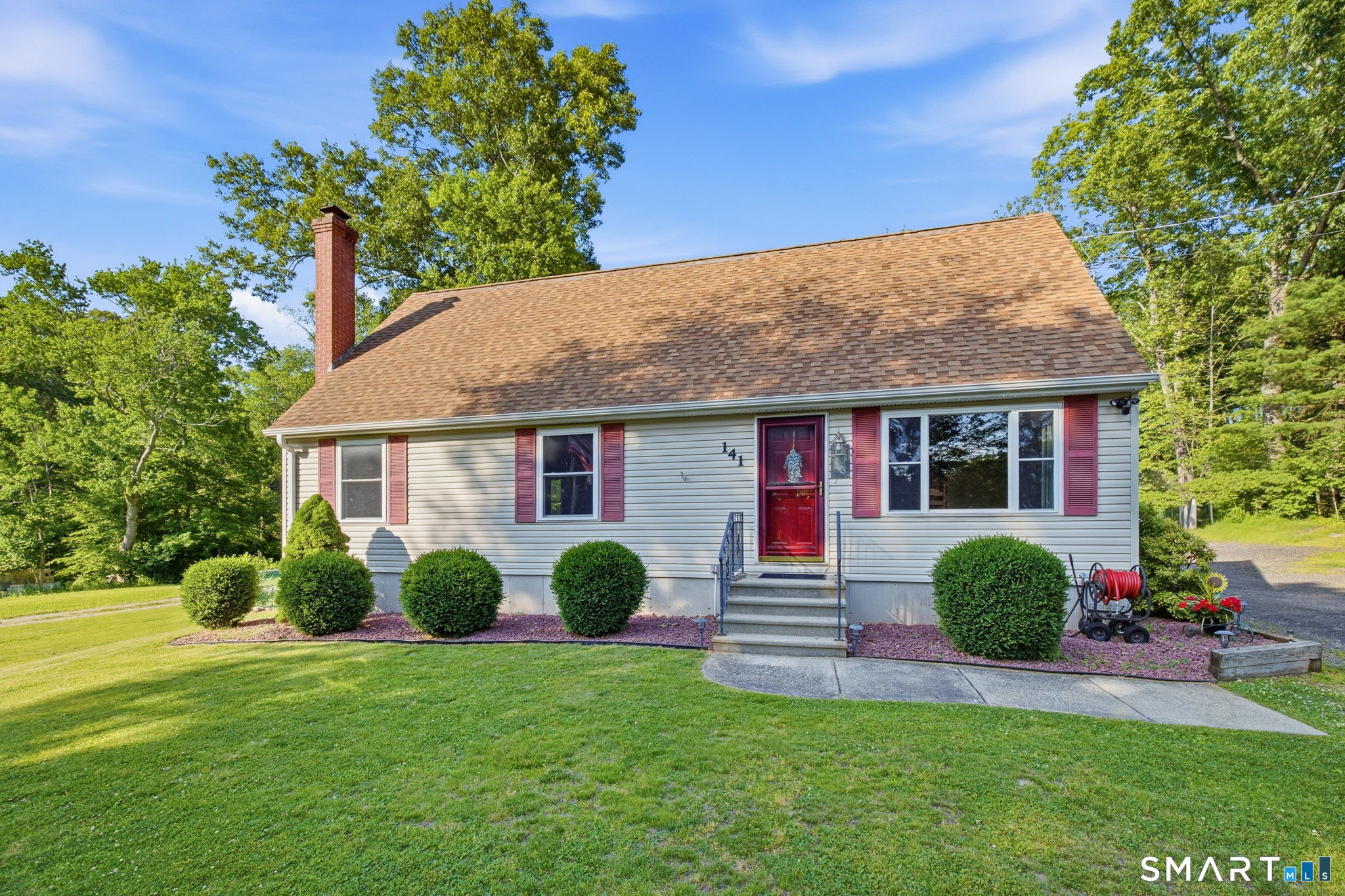 141 Hop River Road Coventry, CT 06238 - Photo 36 of 40 a view of a house with a yard and plants