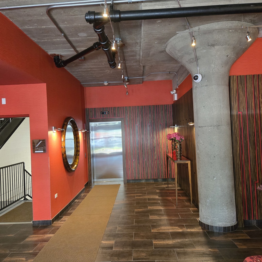 1111 West 15th Street, Unit 228 Chicago, IL 60608 - Photo 4 of 32 a view of a gallery with window
